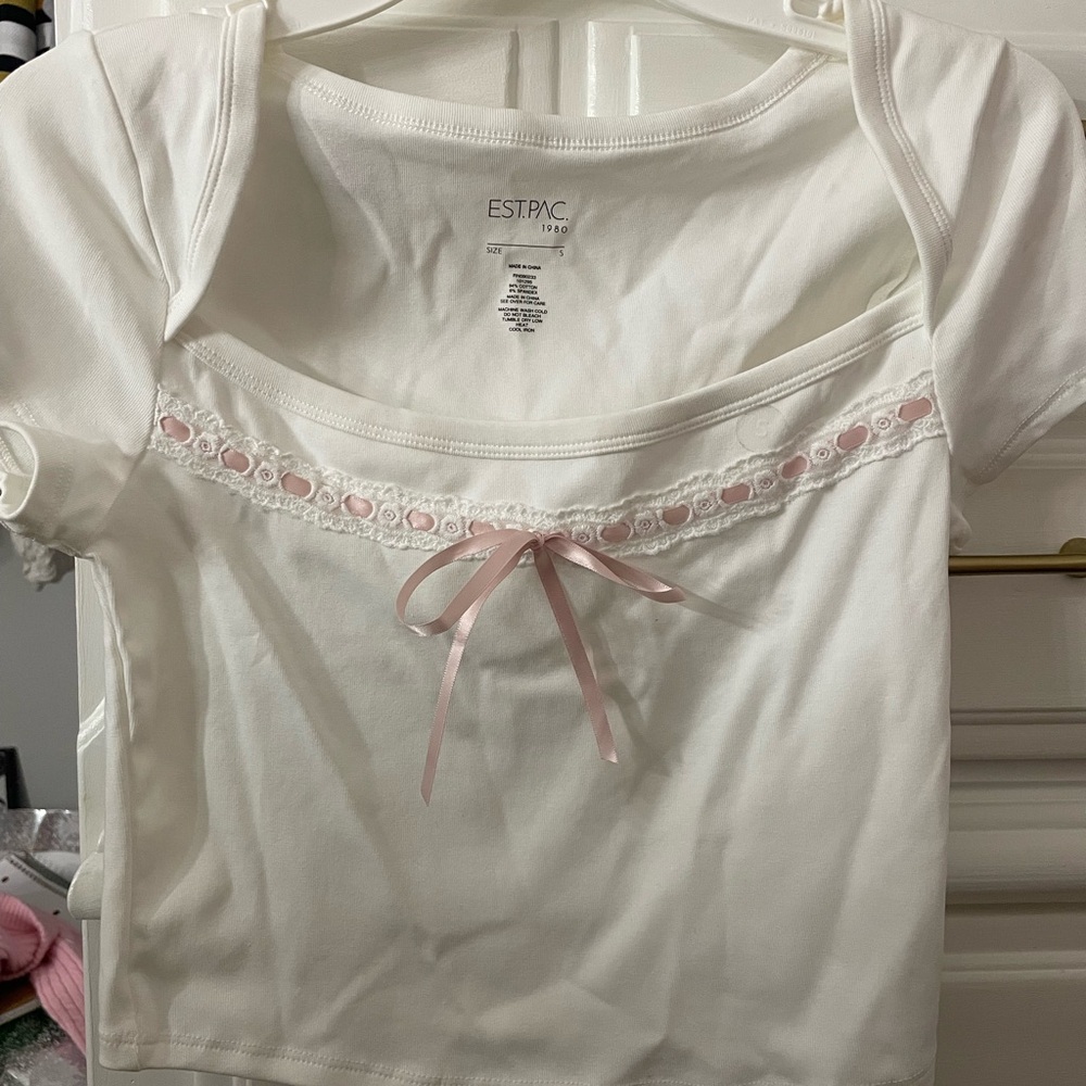 white and pink crop top woth tags